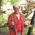 Toni gathering handfuls of mushrooms by the lake at Pickett State Park